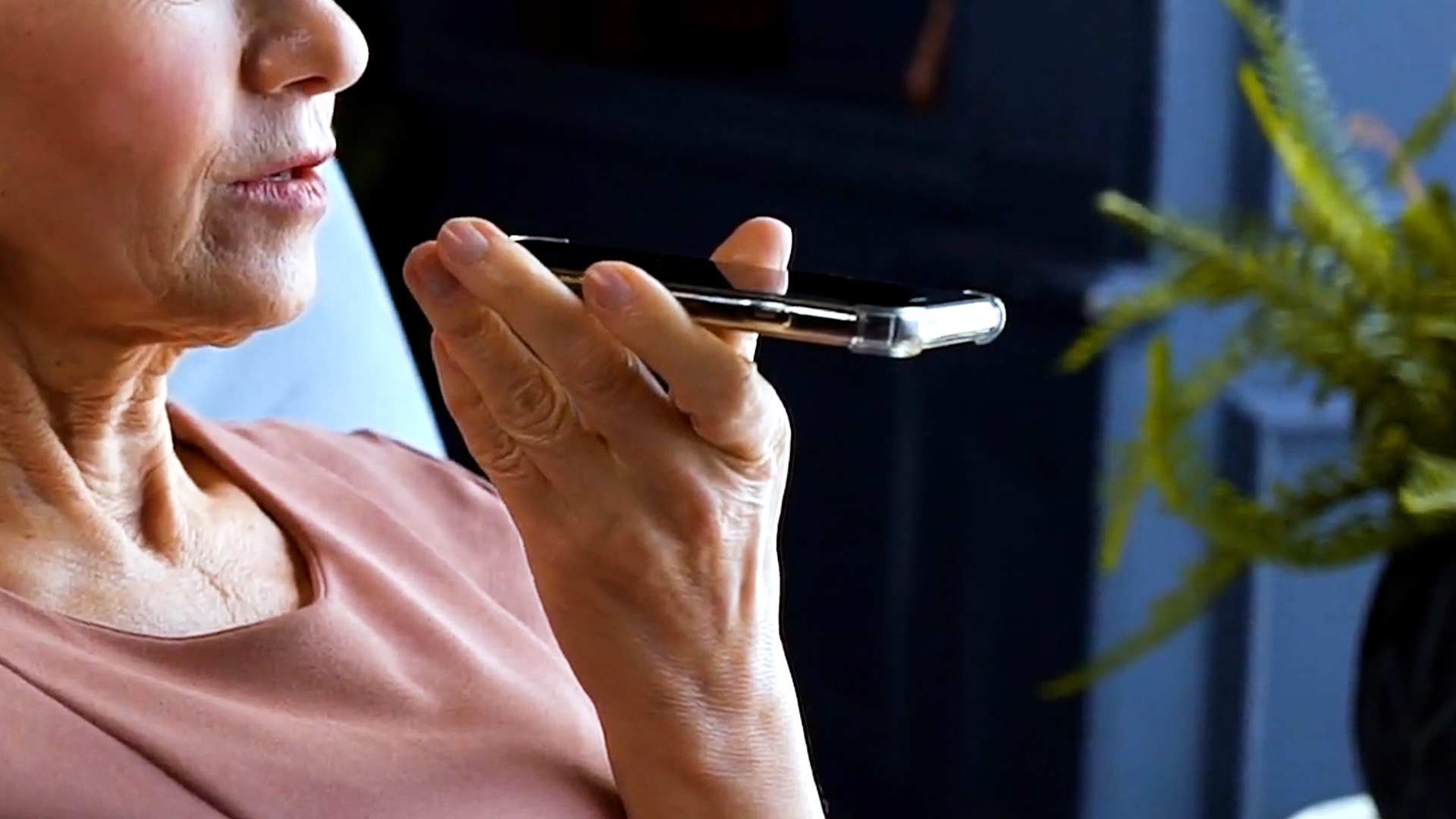 A woman speaking to a cellphone